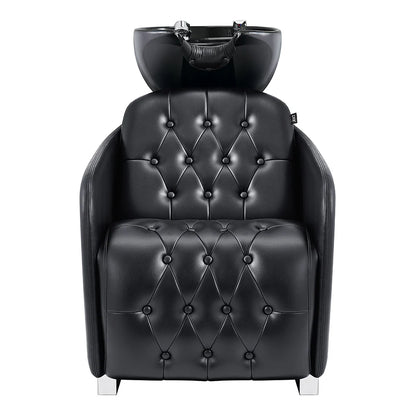 Black leather salon chair with built-in headrest on a white background
