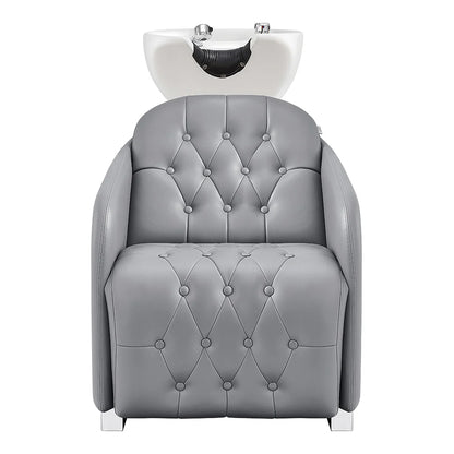 Gray salon chair with white basin on a white background